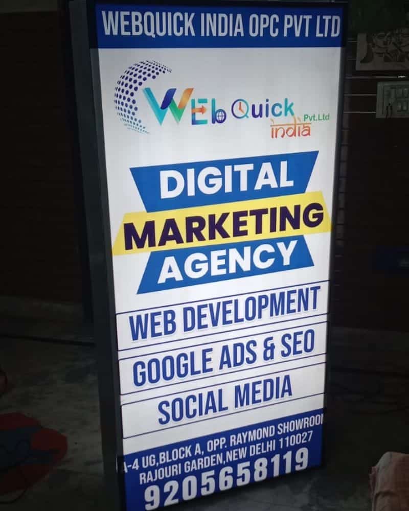 Digital marketing agency signboard with web development and SEO services.